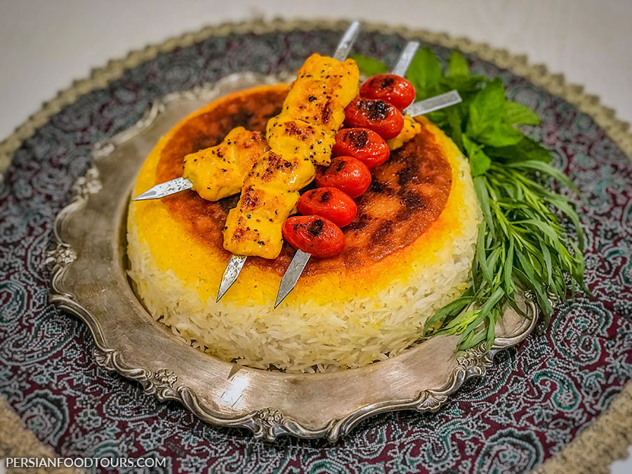 Joojeh Kabab-Persian Chicken Kabab enjoyed with rice and tomatoes